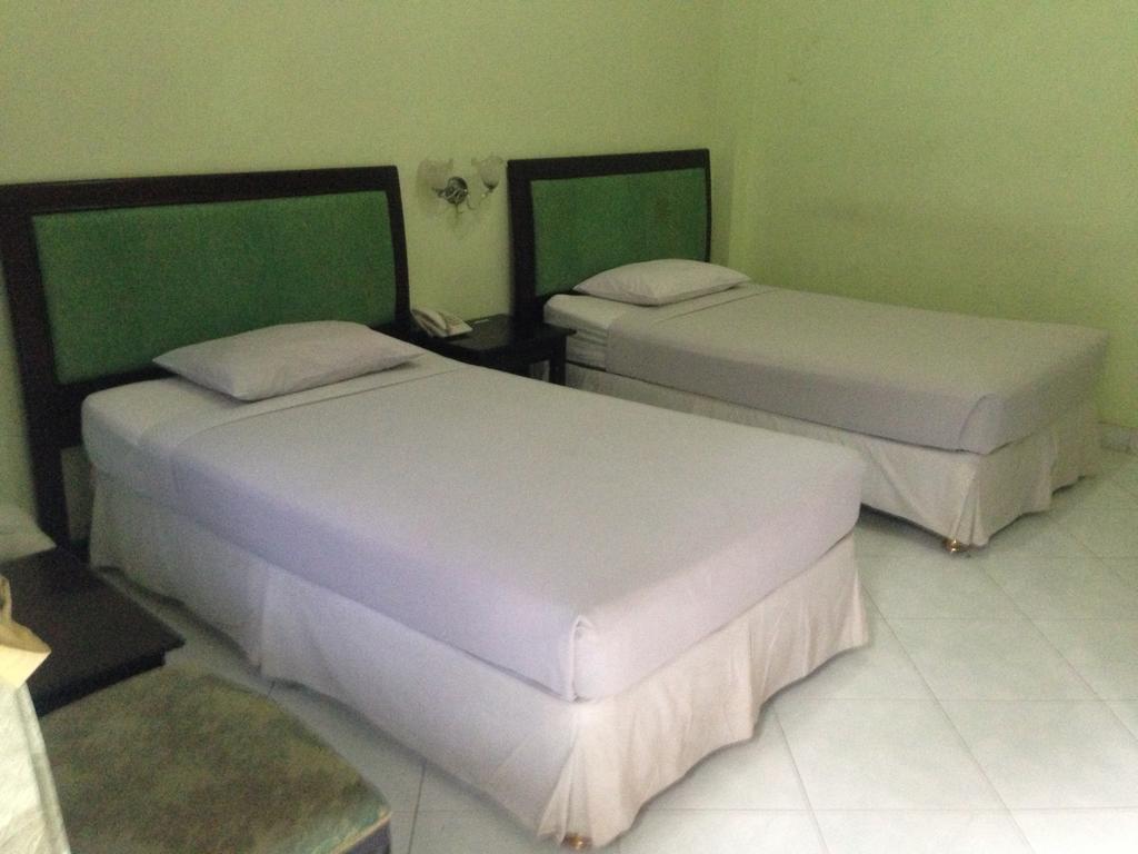 Global Inn Keluarga Sedati Bilik gambar