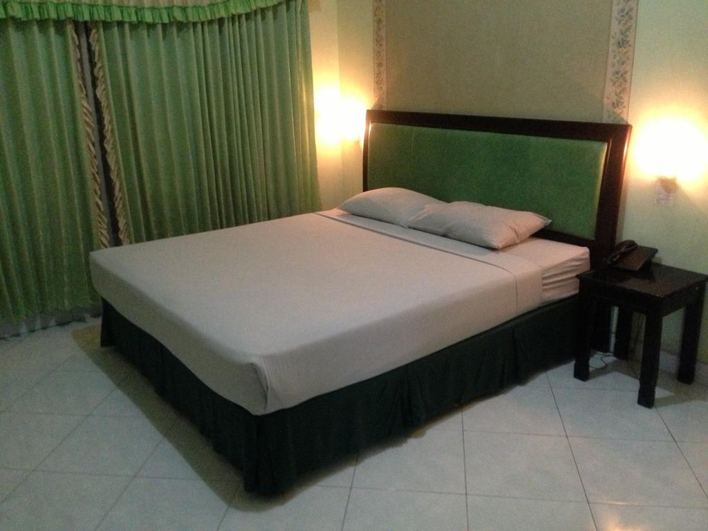 Global Inn Keluarga Sedati Bilik gambar